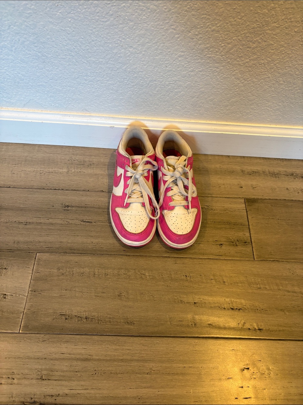 Kids Pink and White Nike Sneakers